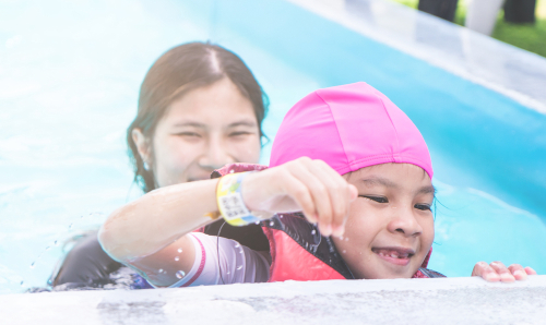 child- earning to swim