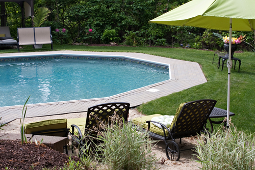 in ground pool and patio