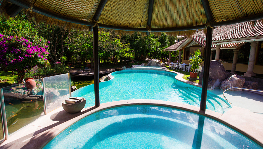 pool partially covered by gazebo