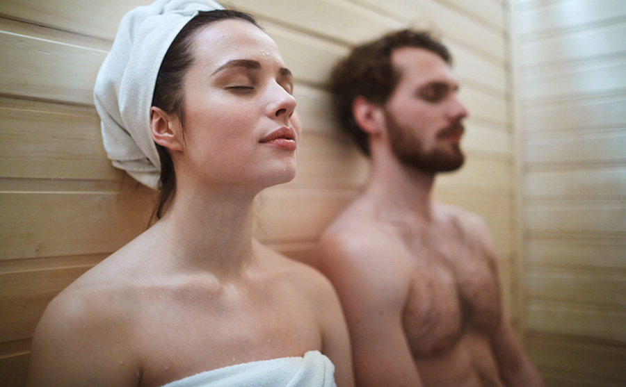 woman enjoying time in sauna with man